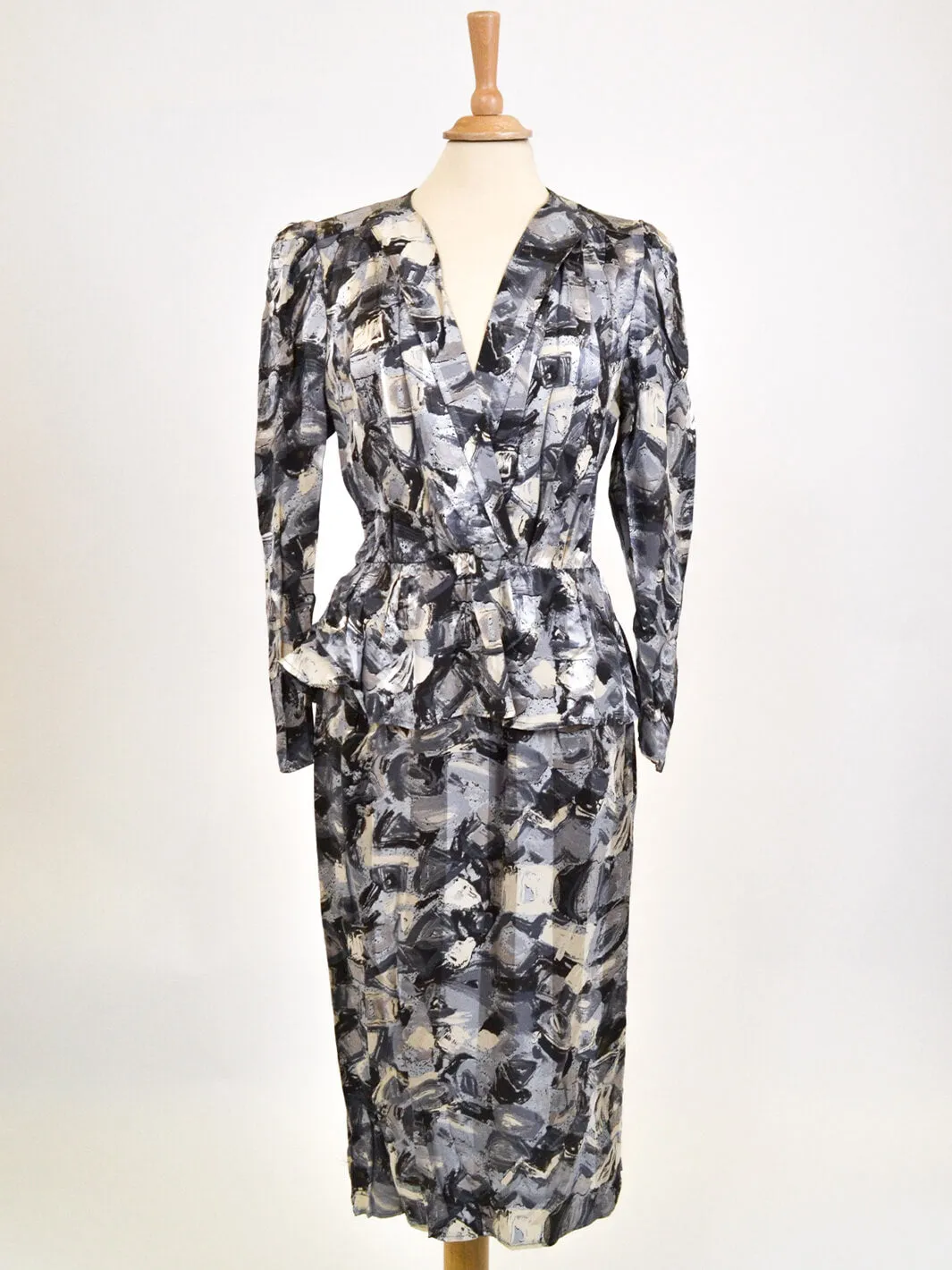 Gray 80s patterned dress.