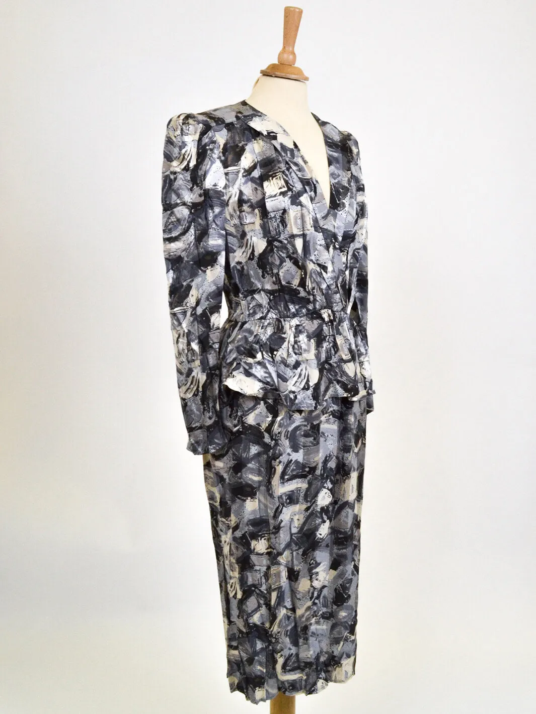 Gray 80s patterned dress.